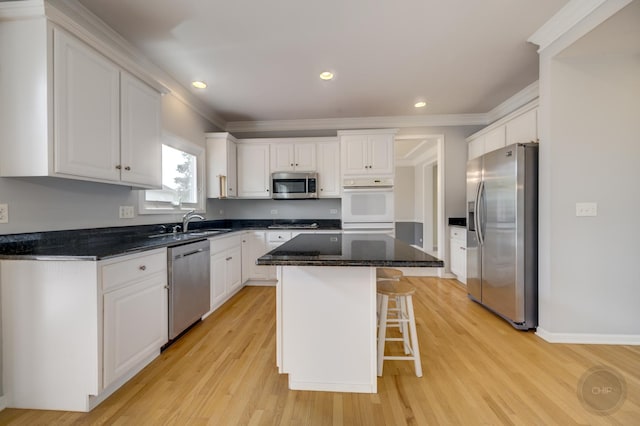 3744 Highknob Cir, Naperville, IL 60564 - kitchen with stainless steel appliances, white cabinetry, a breakfast bar, a center island, and ornamental molding