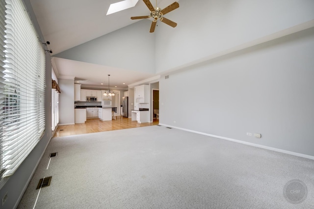3744 Highknob Cir, Naperville, IL 60564 - unfurnished living room featuring plenty of natural light, ceiling fan, light colored carpet, high vaulted ceiling, and baseboards