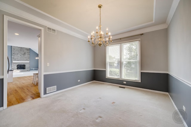 3744 Highknob Cir, Naperville, IL 60564 - spare room featuring a chandelier, ornamental molding, carpet floors, a large fireplace, and baseboards