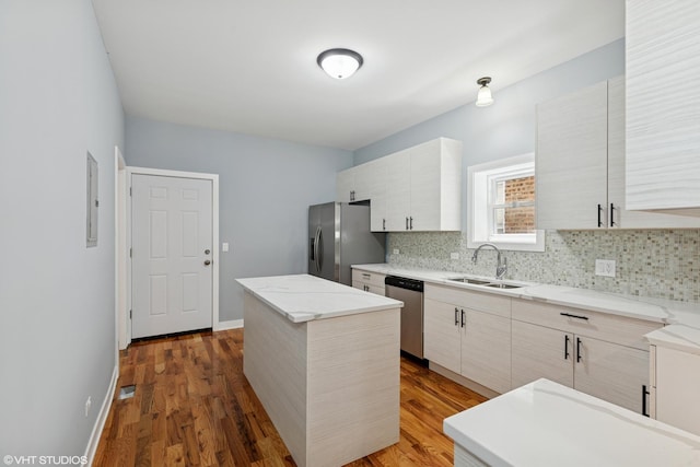 157 N Leamington Ave, Chicago, IL 60644 - kitchen featuring stainless steel appliances, tasteful backsplash, a center island, dark wood-style flooring, and modern cabinets