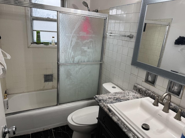11540 S Racine Ave, Chicago, IL 60643 - bathroom featuring toilet, vanity, shower / bath combination with glass door, tile walls, and backsplash