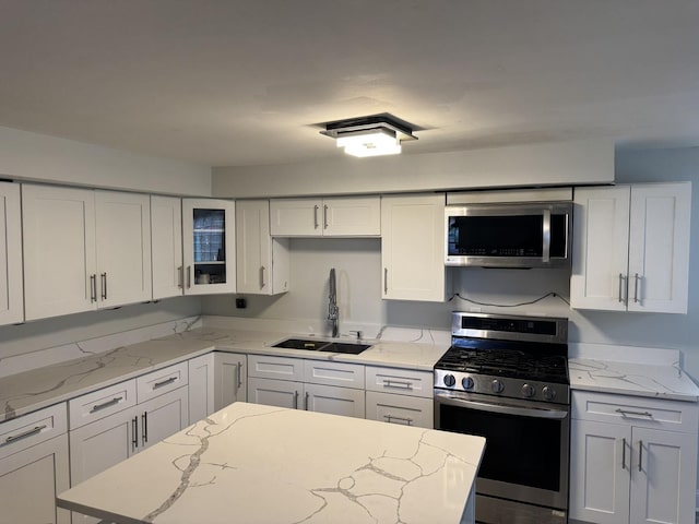 11540 S Racine Ave, Chicago, IL 60643 - kitchen with stainless steel appliances, a sink, white cabinets, and glass insert cabinets