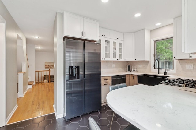 1248 W Fletcher St Unit C, Chicago, IL 60657 - kitchen featuring stainless steel fridge with ice dispenser, a sink, tasteful backsplash, glass insert cabinets, and recessed lighting