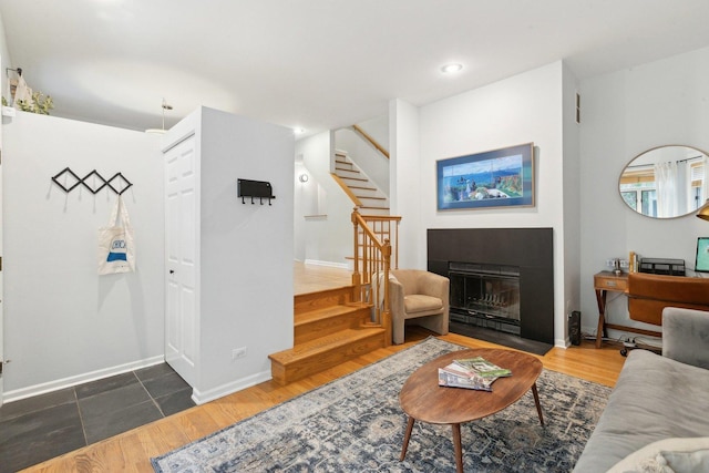 1248 W Fletcher St Unit C, Chicago, IL 60657 - living room featuring stairway, a fireplace with flush hearth, wood finished floors, baseboards, and recessed lighting