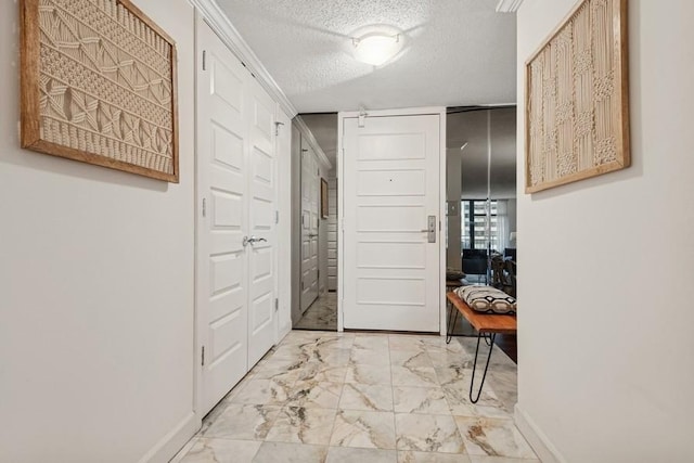 1430 N Astor St Unit 11C, Chicago, IL 60610 - hall with baseboards, light marble finish flooring, and a textured ceiling