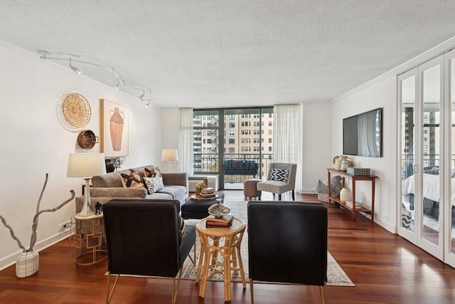 1430 N Astor St Unit 11C, Chicago, IL 60610 - living area featuring wood finished floors, a textured ceiling, baseboards, crown molding, and rail lighting
