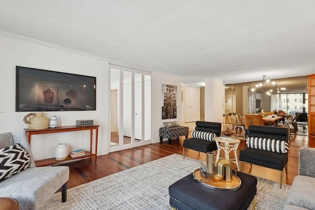 1430 N Astor St Unit 11C, Chicago, IL 60610 - living area with wood finished floors, crown molding, and a chandelier