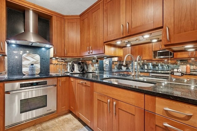 1430 N Astor St Unit 11C, Chicago, IL 60610 - kitchen featuring appliances with stainless steel finishes, a sink, and brown cabinets