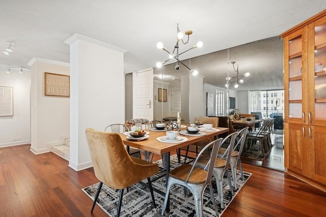 1430 N Astor St Unit 11C, Chicago, IL 60610 - dining area with a chandelier, rail lighting, dark wood-type flooring, crown molding, and stairs