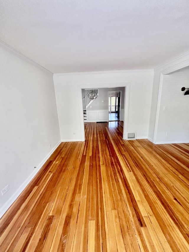 4118 N Kedzie Ave, Chicago, IL 60618 - spare room featuring light wood-style flooring, crown molding, and baseboards
