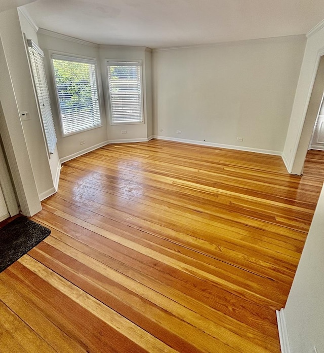 4118 N Kedzie Ave, Chicago, IL 60618 - empty room featuring crown molding, light wood-type flooring, and baseboards
