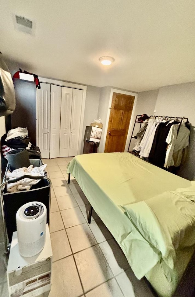 4118 N Kedzie Ave, Chicago, IL 60618 - bedroom featuring light tile patterned floors and a closet