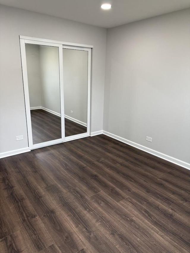 9B Kingery Quarter Unit 108, Willowbrook, IL 60527 - unfurnished bedroom with dark wood-style flooring, recessed lighting, and a closet