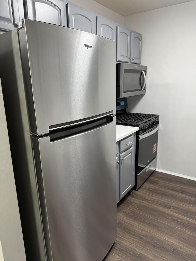 9B Kingery Quarter Unit 108, Willowbrook, IL 60527 - kitchen featuring appliances with stainless steel finishes, gray cabinets, dark wood finished floors, and light countertops
