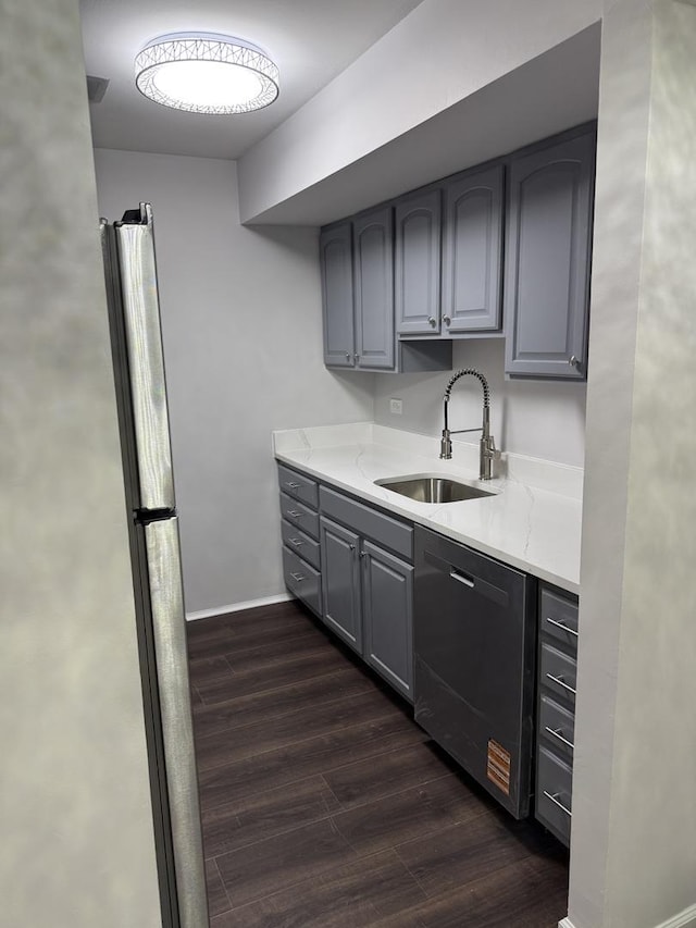 9B Kingery Quarter Unit 108, Willowbrook, IL 60527 - kitchen featuring dishwasher, dark wood finished floors, gray cabinetry, and light stone countertops