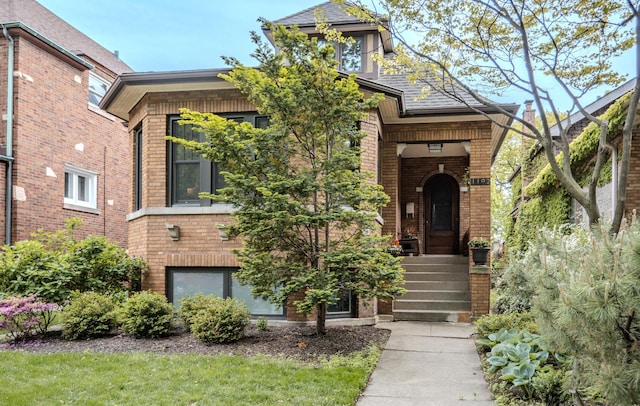 1102 Brummel St, Evanston, IL 60202 - view of front of home featuring brick siding and roof with shingles