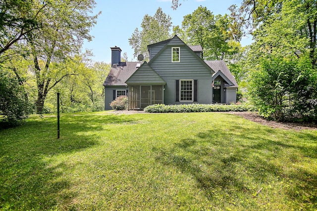 16864 E State Route 17, Grant Park, IL 60940 - rear view of property with roof with shingles, a yard, a sunroom, and a chimney