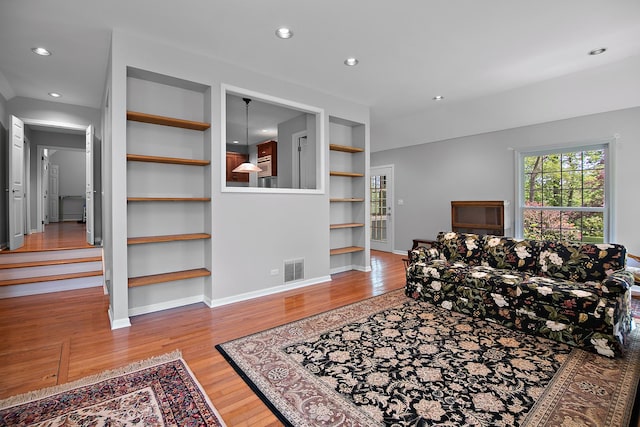 16864 E State Route 17, Grant Park, IL 60940 - living area featuring built in features, wood finished floors, baseboards, and recessed lighting