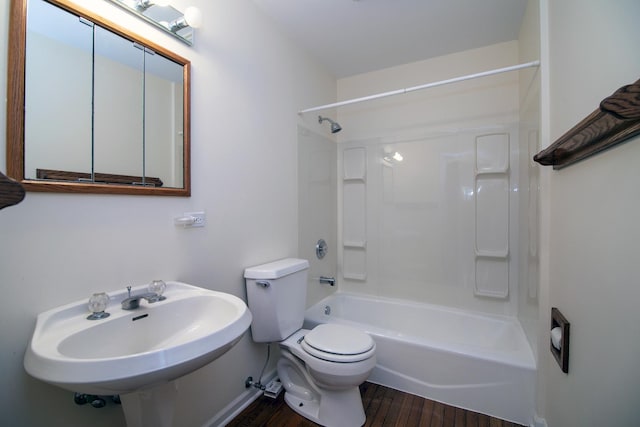 16864 E State Route 17, Grant Park, IL 60940 - full bathroom featuring wood finished floors, tub / shower combination, toilet, a sink, and baseboards