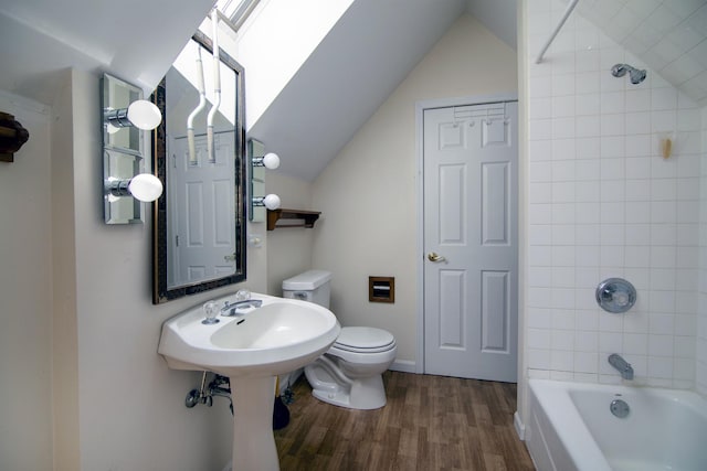 16864 E State Route 17, Grant Park, IL 60940 - bathroom featuring wood finished floors, lofted ceiling, toilet, and washtub / shower combination