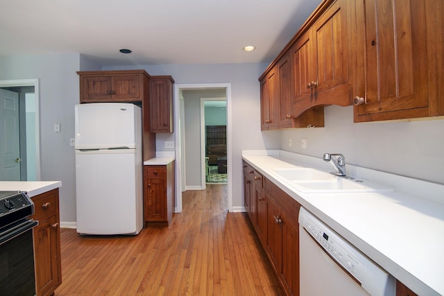 16864 E State Route 17, Grant Park, IL 60940 - kitchen with white appliances, light wood-type flooring, light countertops, recessed lighting, and baseboards