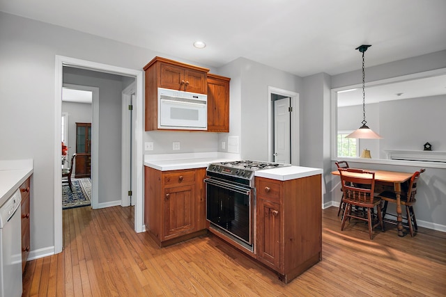 16864 E State Route 17, Grant Park, IL 60940 - kitchen featuring gas range oven, dishwasher, brown cabinets, light wood-type flooring, and recessed lighting
