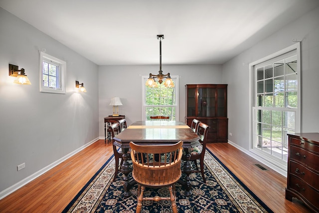 16864 E State Route 17, Grant Park, IL 60940 - dining room featuring light wood-type flooring, a chandelier, and baseboards