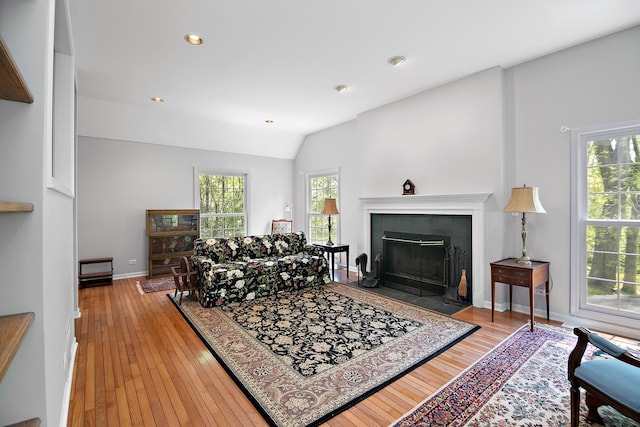16864 E State Route 17, Grant Park, IL 60940 - living room featuring a tiled fireplace, wood-type flooring, lofted ceiling, baseboards, and recessed lighting