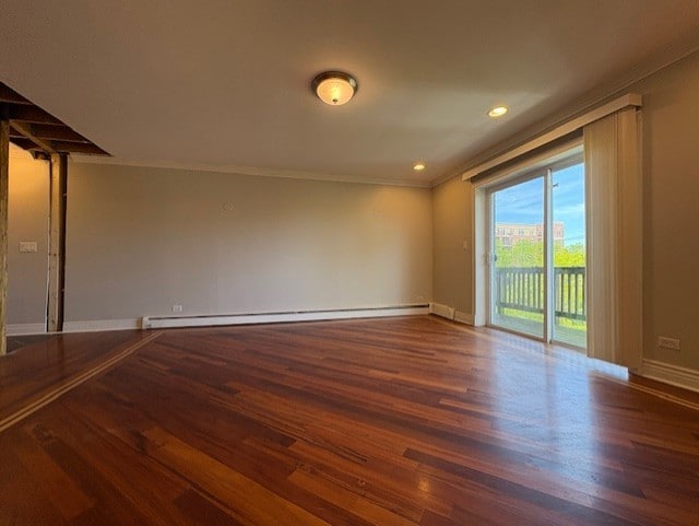 8232 Niles Center Rd Unit 317, Skokie, IL 60077 - spare room featuring wood finished floors, baseboards, crown molding, baseboard heating, and recessed lighting