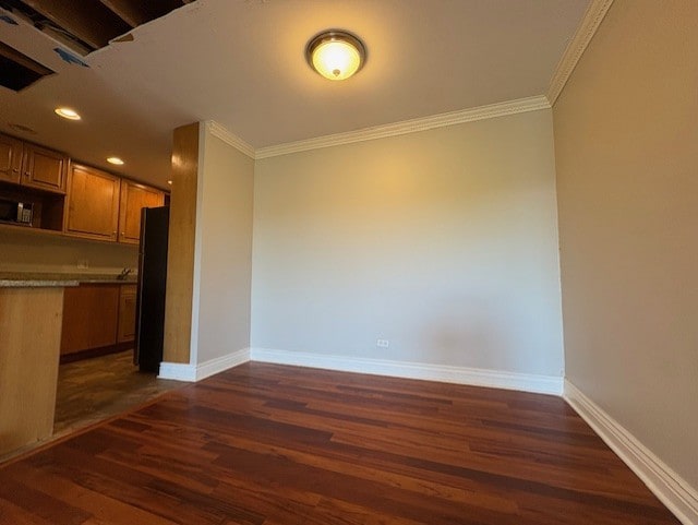 8232 Niles Center Rd Unit 317, Skokie, IL 60077 - unfurnished dining area with dark wood-type flooring, crown molding, baseboards, and recessed lighting