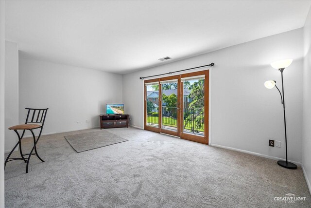1120 N Farnsworth Ave Unit 2C, Aurora, IL 60505 - living area with carpet and baseboards