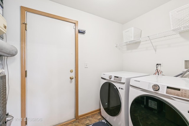 6417 Blue Sky Ln, Matteson, IL 60443 - laundry area with independent washer and dryer, stone finish floors, and baseboards