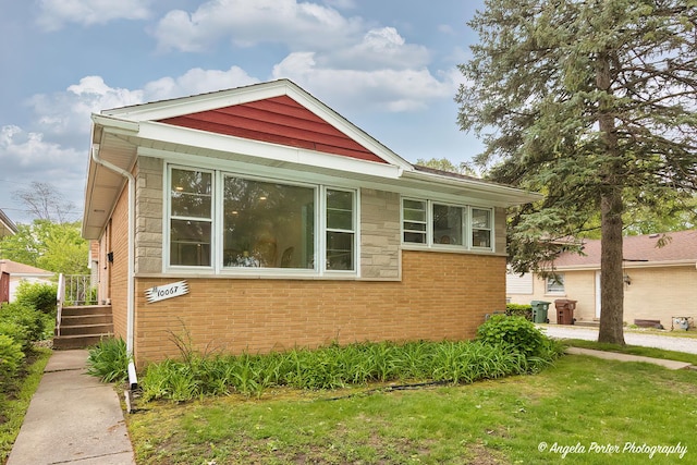 10067 Lavergne Ave, Skokie, IL 60077 - view of side of home with a lawn and brick siding