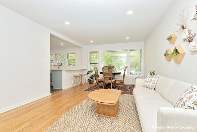 10067 Lavergne Ave, Skokie, IL 60077 - living room with wood finished floors, recessed lighting, and baseboards