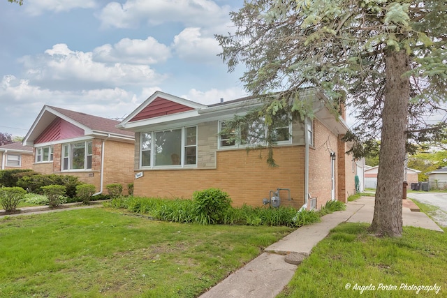 10067 Lavergne Ave, Skokie, IL 60077 - view of side of home featuring a lawn and brick siding