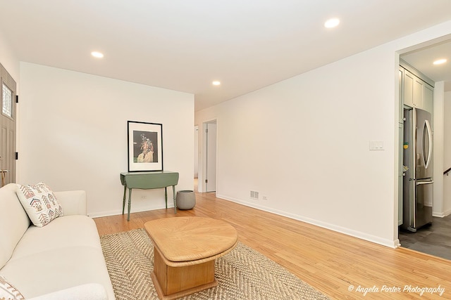 10067 Lavergne Ave, Skokie, IL 60077 - living room with light wood-style floors, recessed lighting, and baseboards