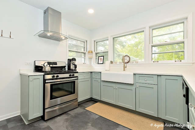 10067 Lavergne Ave, Skokie, IL 60077 - kitchen with gas range, wall chimney exhaust hood, a sink, green cabinets, and recessed lighting