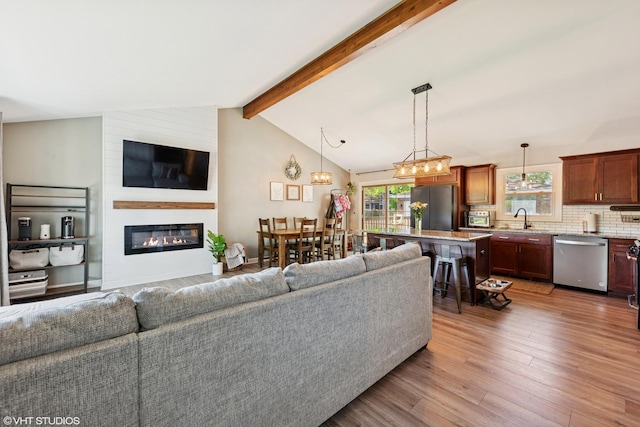 2109 Sprucewood Ln, Lindenhurst, IL 60046 - living room featuring light wood-style floors and a fireplace