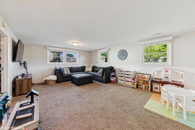 2109 Sprucewood Ln, Lindenhurst, IL 60046 - living room featuring a wainscoted wall and carpet floors