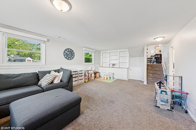 2109 Sprucewood Ln, Lindenhurst, IL 60046 - living area featuring carpet floors, stairs, and built in features