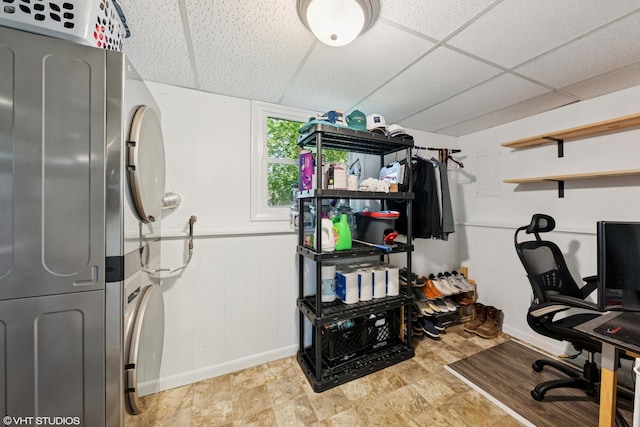 2109 Sprucewood Ln, Lindenhurst, IL 60046 - home office with baseboards, stacked washer / drying machine, a paneled ceiling, and a decorative wall