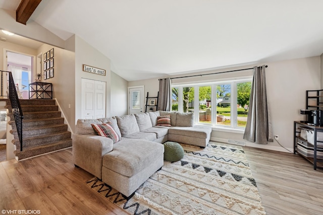 2109 Sprucewood Ln, Lindenhurst, IL 60046 - living area featuring light wood-style floors, stairway, and baseboards