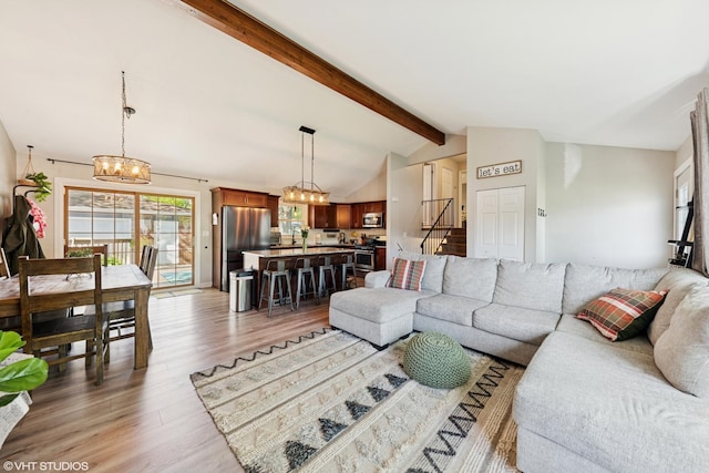 2109 Sprucewood Ln, Lindenhurst, IL 60046 - living room featuring a chandelier and light wood-type flooring