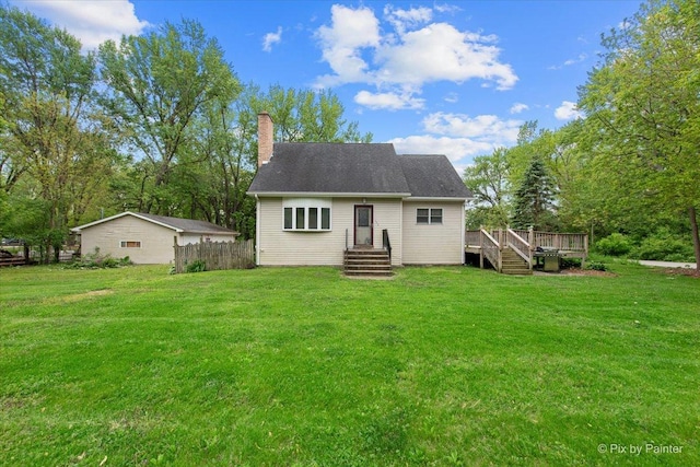 119 W S Ave, Spring Grove, IL 60081 - rear view of house with a chimney and a wooden deck