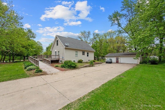 119 W S Ave, Spring Grove, IL 60081 - view of property exterior featuring a deck, a lawn, a detached garage, and an outbuilding