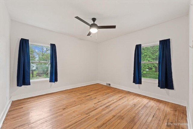 119 W S Ave, Spring Grove, IL 60081 - unfurnished room with hardwood / wood-style flooring, ceiling fan, and baseboards