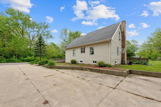 119 W S Ave, Spring Grove, IL 60081 - view of home's exterior featuring central AC unit and a patio area