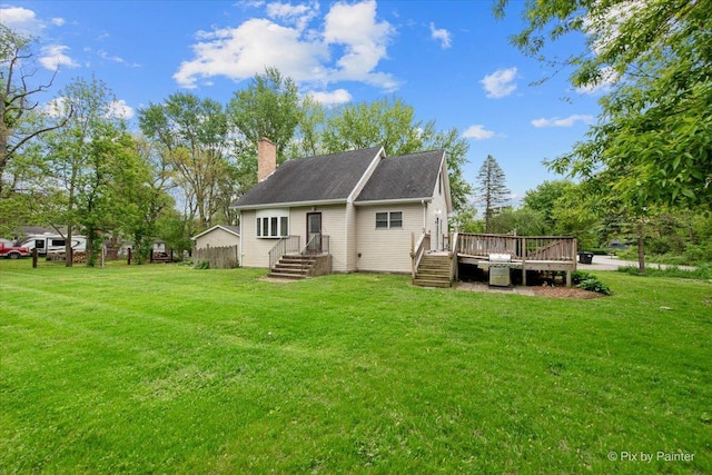 119 W S Ave, Spring Grove, IL 60081 - back of house featuring a chimney, a lawn, a wooden deck, and roof with shingles