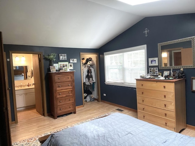 30W071 Kensington Dr, Warrenville, IL 60555 - bedroom with wood finished floors, lofted ceiling, connected bathroom, a closet, and baseboards