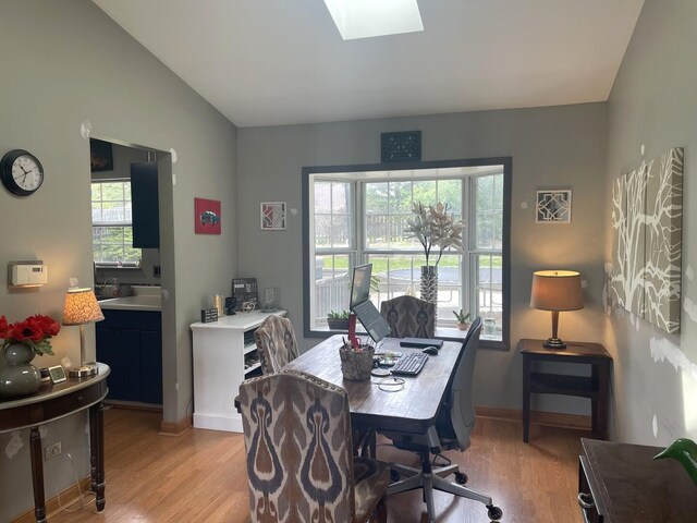 30W071 Kensington Dr, Warrenville, IL 60555 - office area with light wood-style floors, a skylight, and baseboards